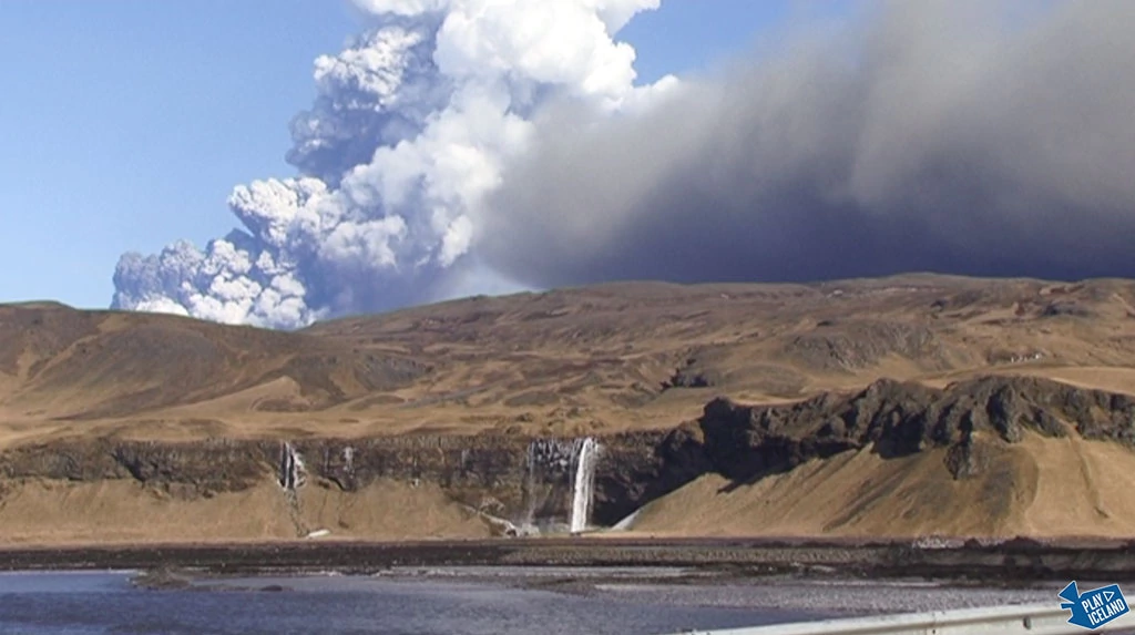 Eyjafjallajokull volcano over Seljalandsfoss Iceland